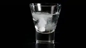 Image of an Aspirin blood thinning medicine dissolving in a glass